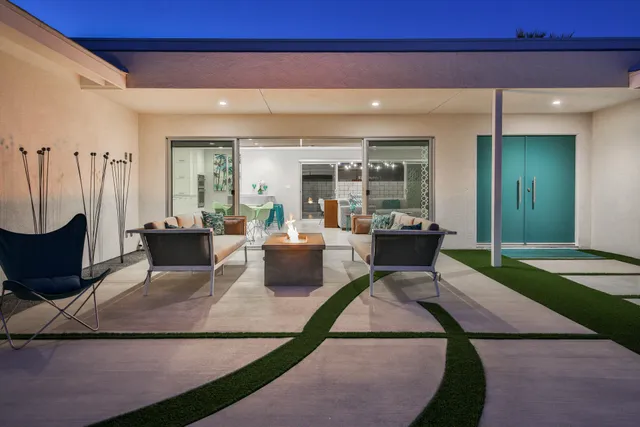a living room with furniture a rug and a fireplace