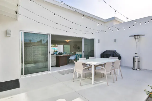 a view of a house with sitting area and furniture