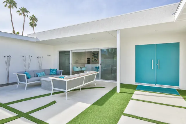 a bathroom with a sink vanity mirror and toilet