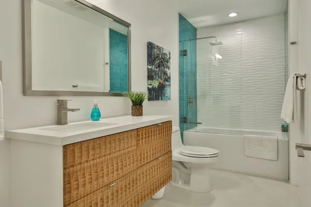 a bedroom with a large bed and a couch