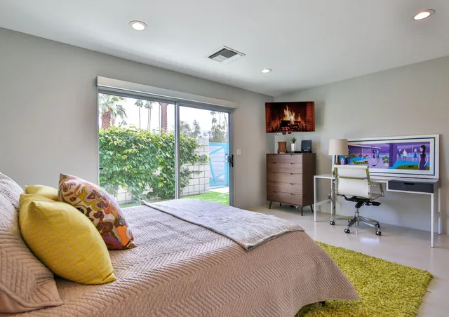 a dining area with a table chairs and a kitchen view