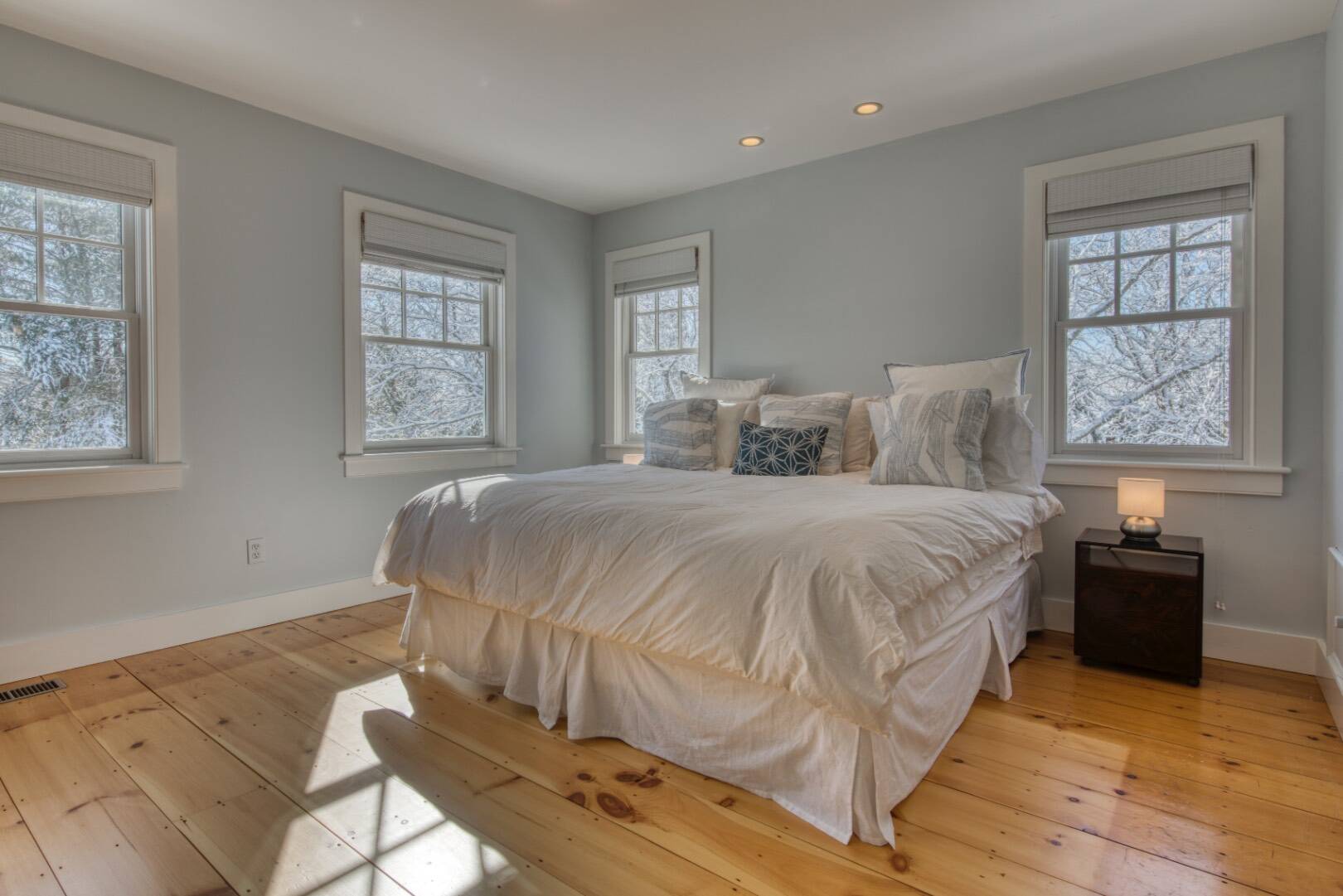 Undisclosed Address Bridgehampton, NY 11932 - Photo 12 of 21 a spacious bedroom with a bed and wooden floor