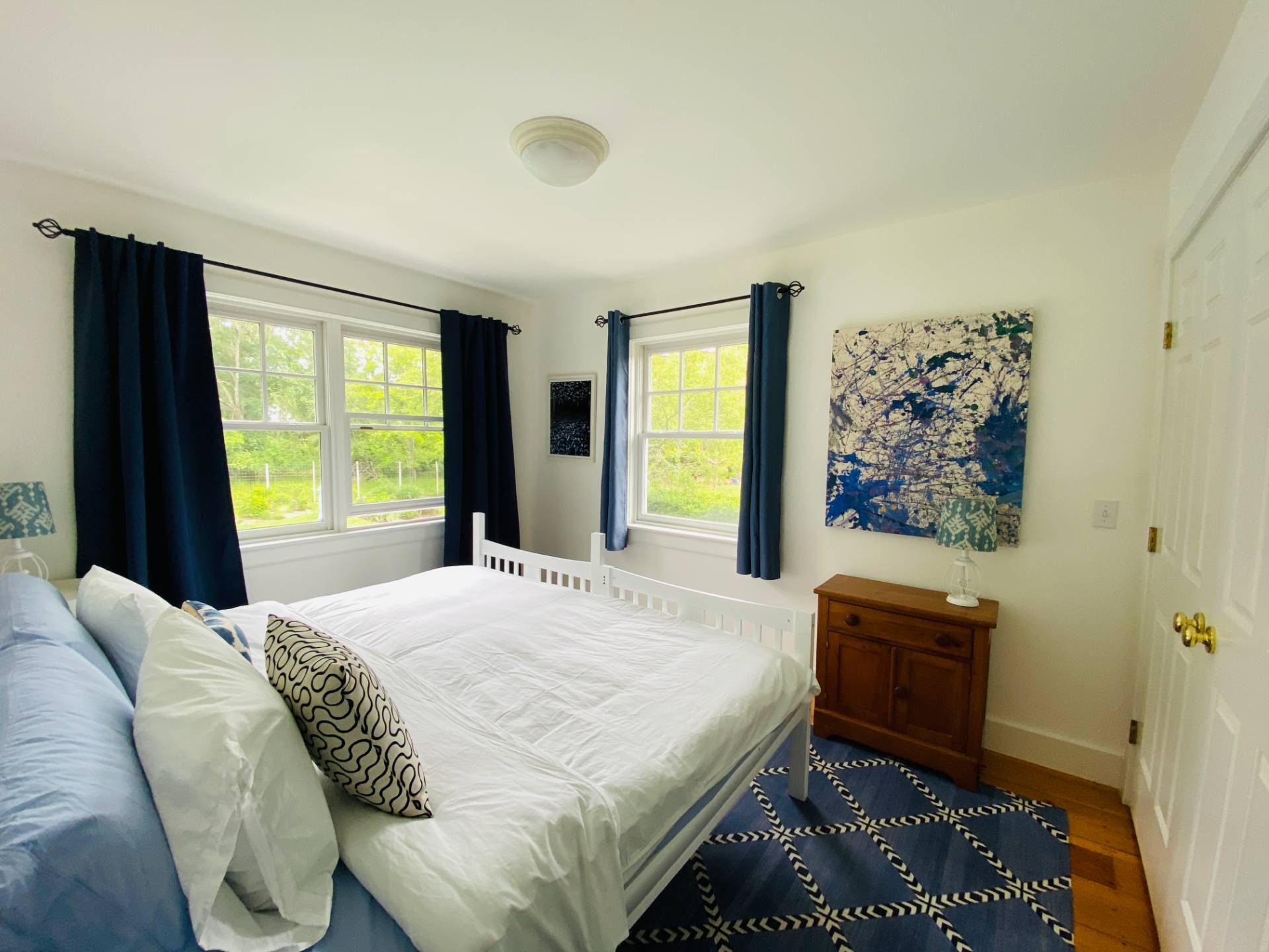 Undisclosed Address Bridgehampton, NY 11932 - Photo 14 of 21 a bedroom with a bed and a window