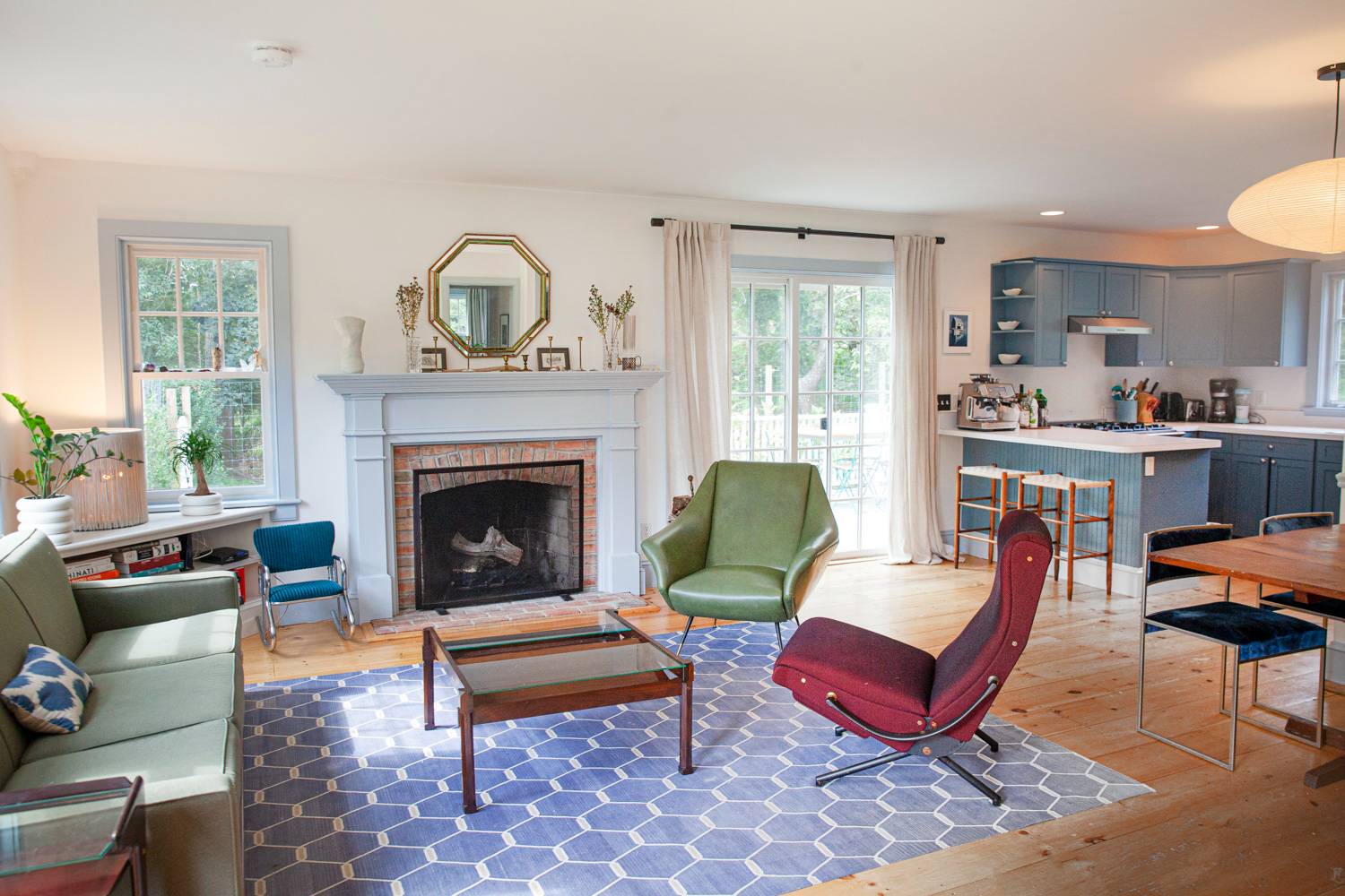 Undisclosed Address Bridgehampton, NY 11932 - Photo 6 of 21 a living room with furniture a rug and a fireplace