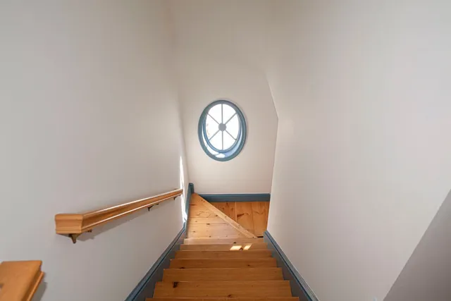 a view of an entryway with wooden floor