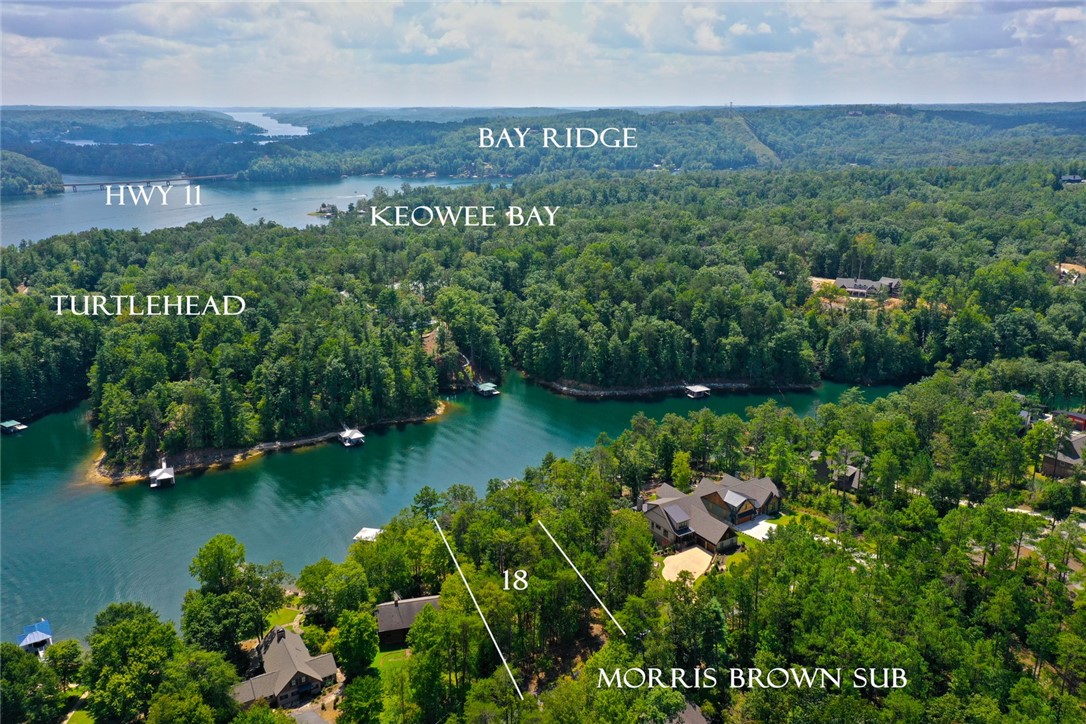 590 Old Chapman Bridge Road Salem, SC 29676 - Photo 5 of 43 Lush woodlands and deep blue waters frame this exceptional lakeside property setting.