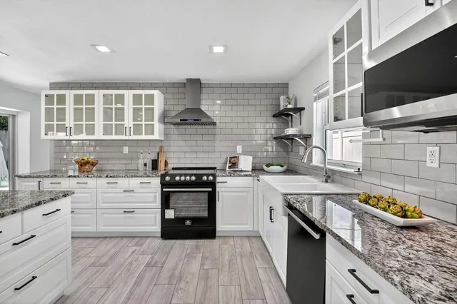 a bedroom with a bed and painting on the wall