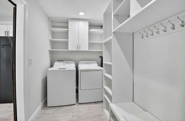 a bedroom with furniture and a flat screen tv