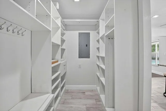 a bathroom with a double vanity sink toilet and shower