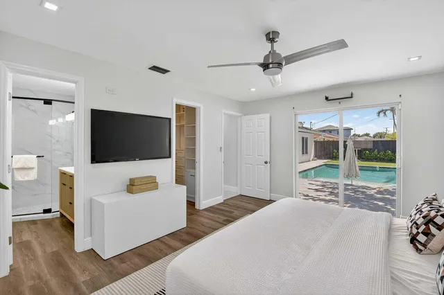 a bathroom with a bathtub and shower