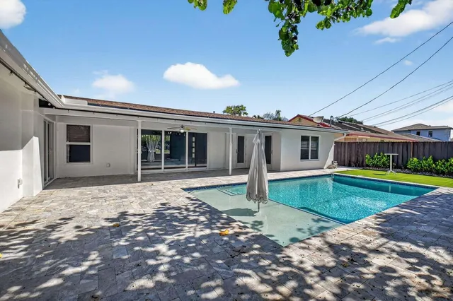 an aerial view of a house with a garden and plants
