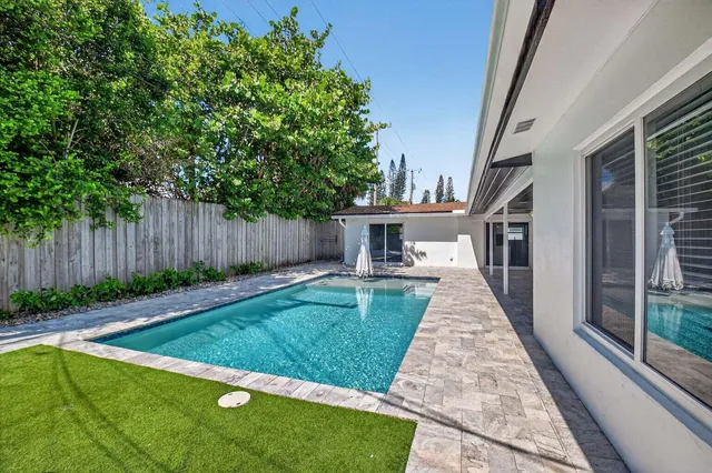 an aerial view of residential houses with city view