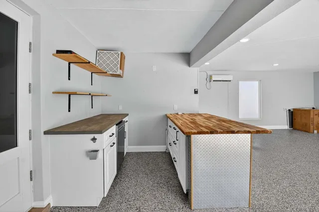 an aerial view of multiple houses with yard