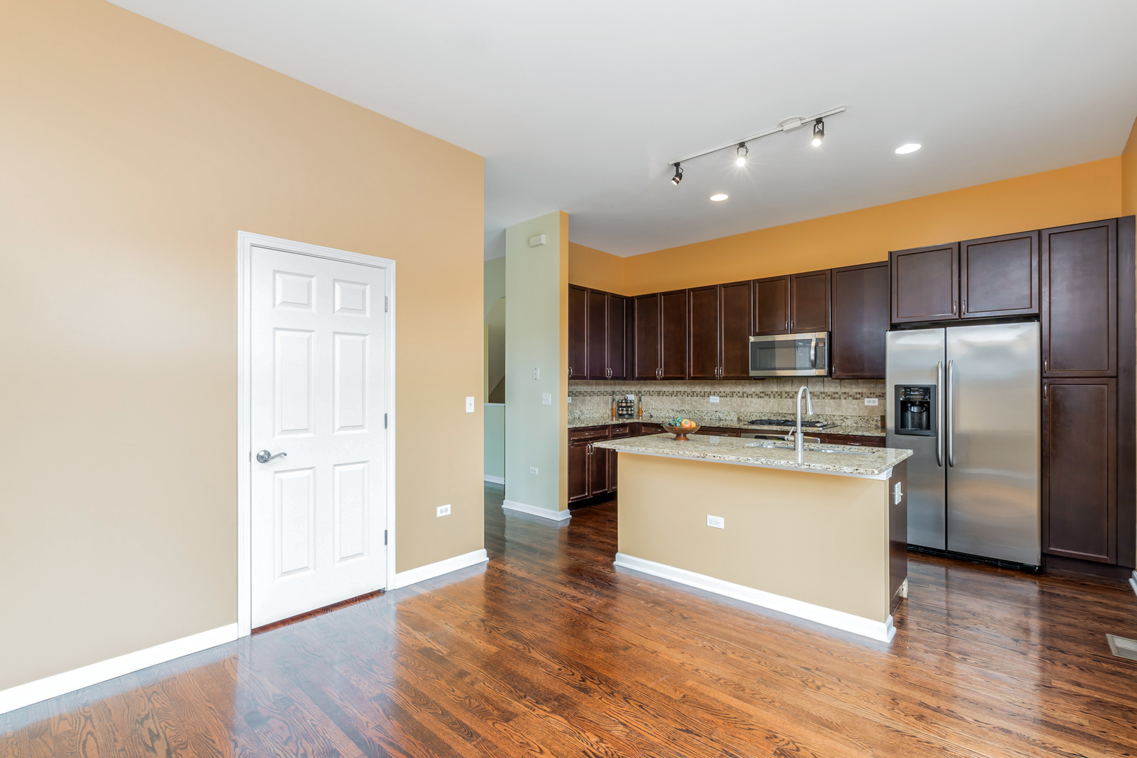 721 West 15th Street Chicago, IL 60607 - Photo 14 of 27 a kitchen with stainless steel appliances granite countertop a refrigerator and a stove top oven