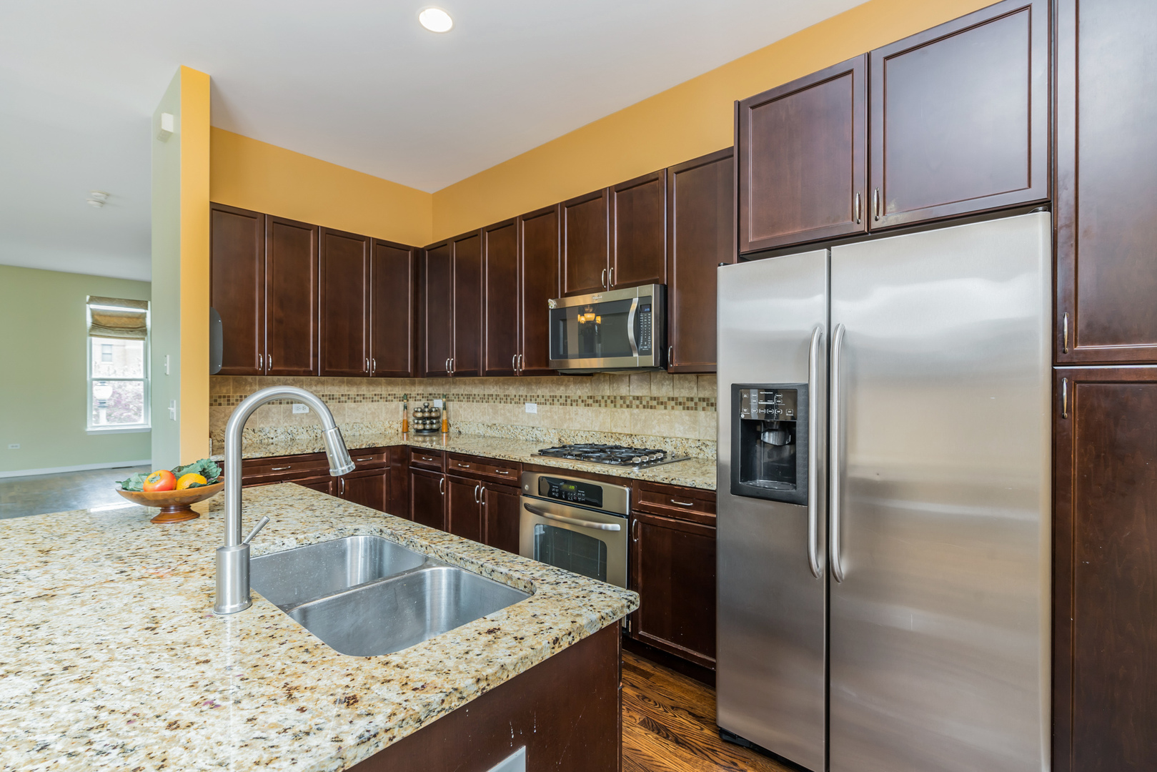 721 West 15th Street Chicago, IL 60607 - Photo 15 of 27 a kitchen with stainless steel appliances granite countertop a refrigerator a sink and a stove