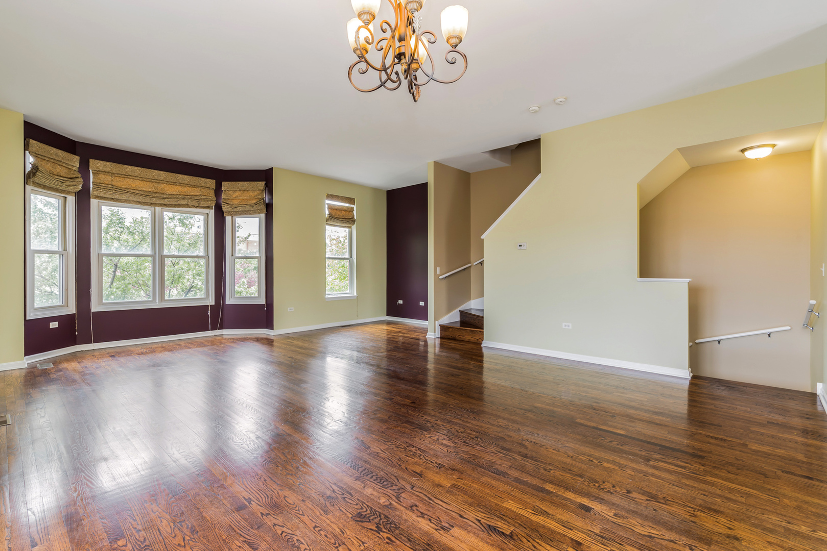 721 West 15th Street Chicago, IL 60607 - Photo 9 of 27 a view of an empty room with wooden floor and a window