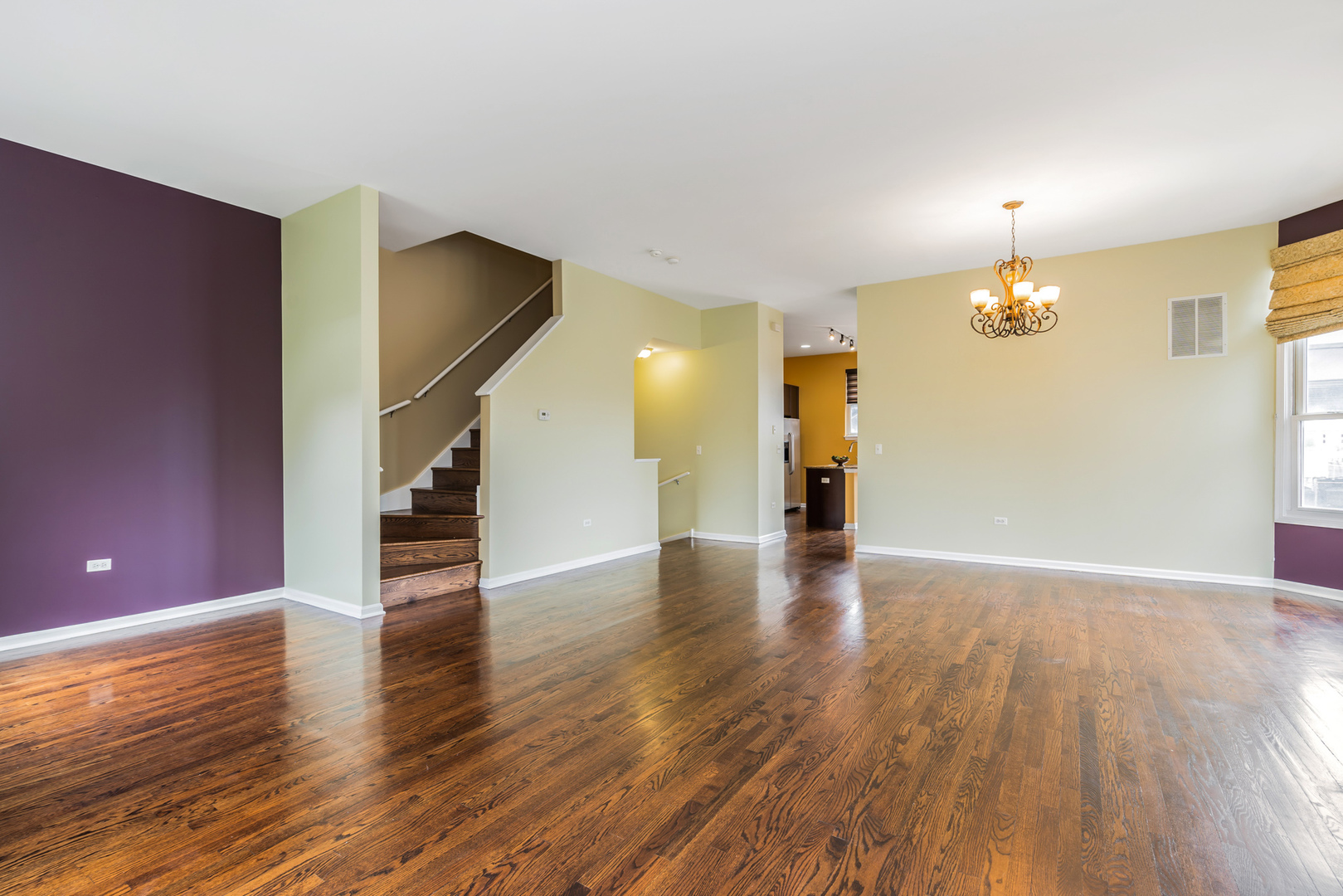 721 West 15th Street Chicago, IL 60607 - Photo 10 of 27 a view of an empty room with wooden floor and a window