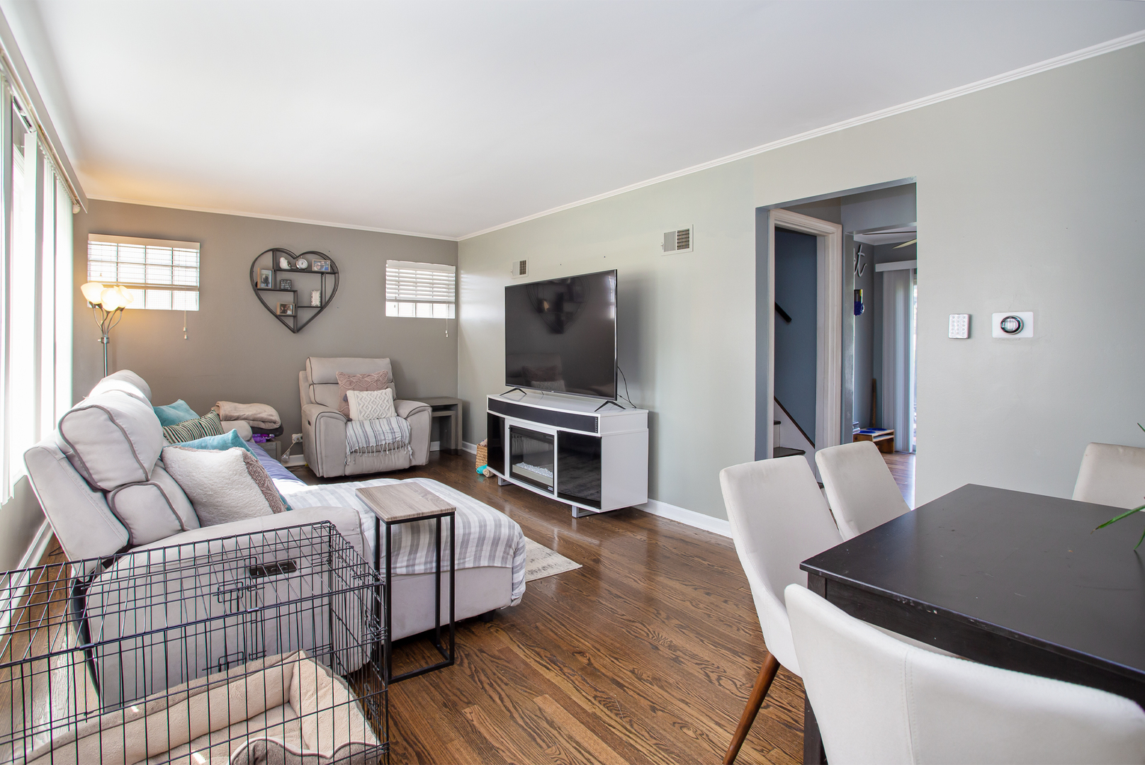 243 Clayton Road Hillside, IL 60162 - Photo 2 of 17 a bedroom with furniture and a flat screen tv