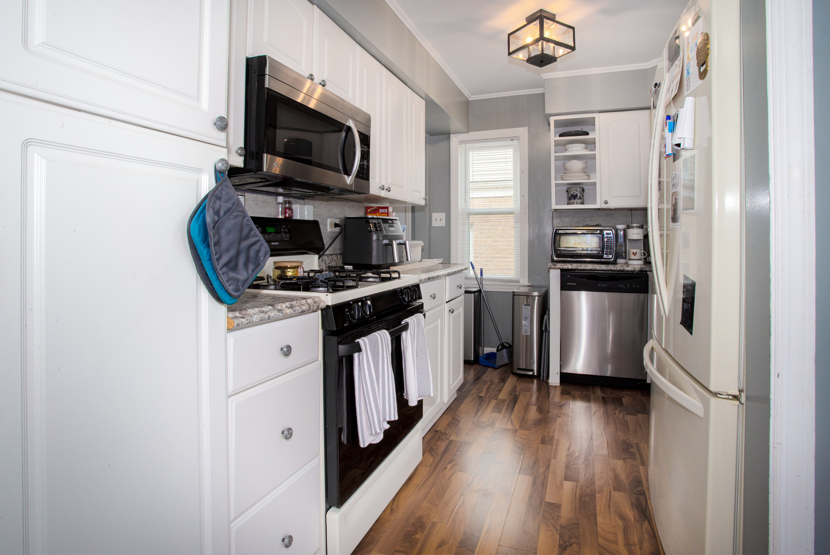 243 Clayton Road Hillside, IL 60162 - Photo 5 of 17 a kitchen with stainless steel appliances a stove microwave and a refrigerator