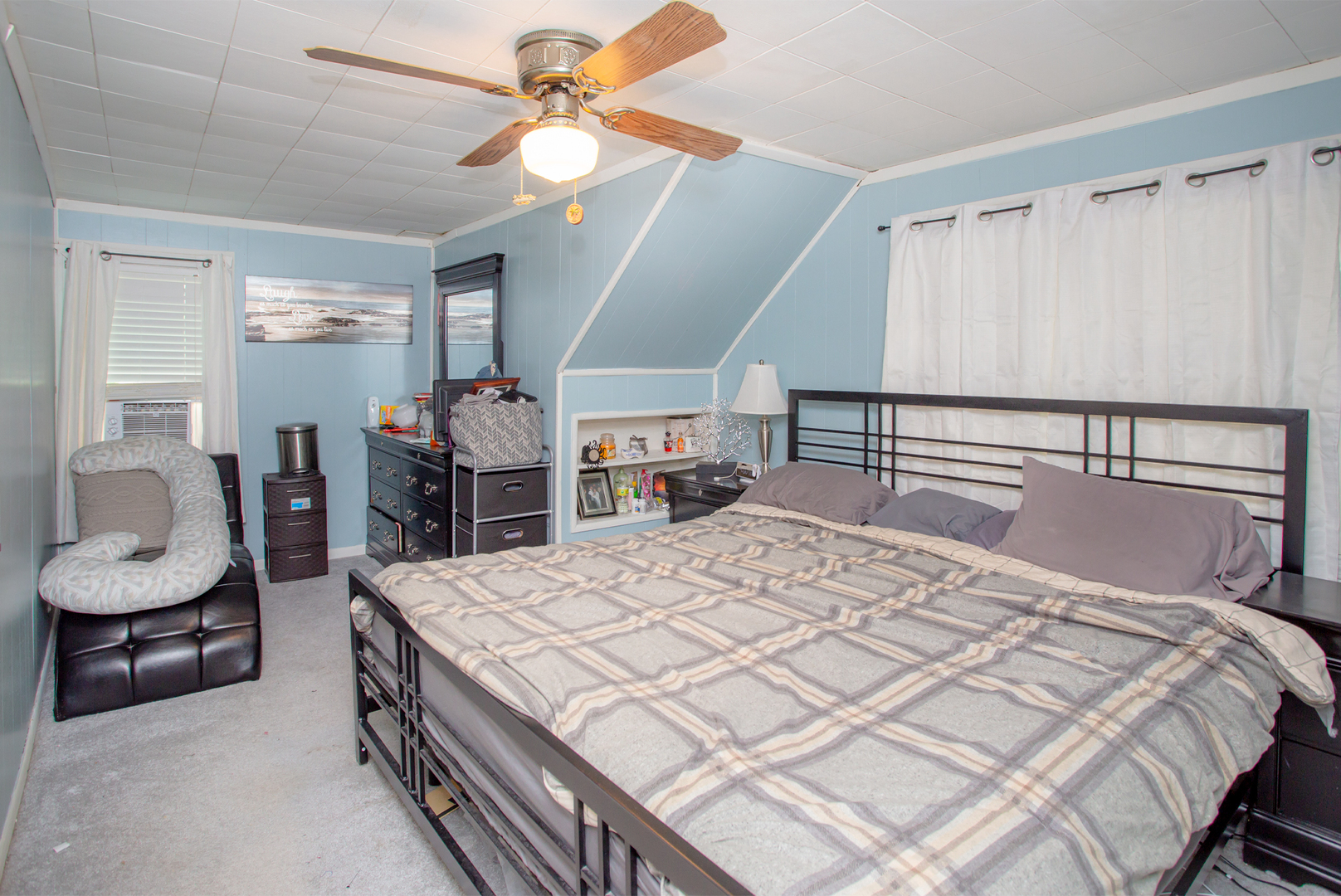 243 Clayton Road Hillside, IL 60162 - Photo 6 of 17 a bedroom with a bed a furniture and a chandelier