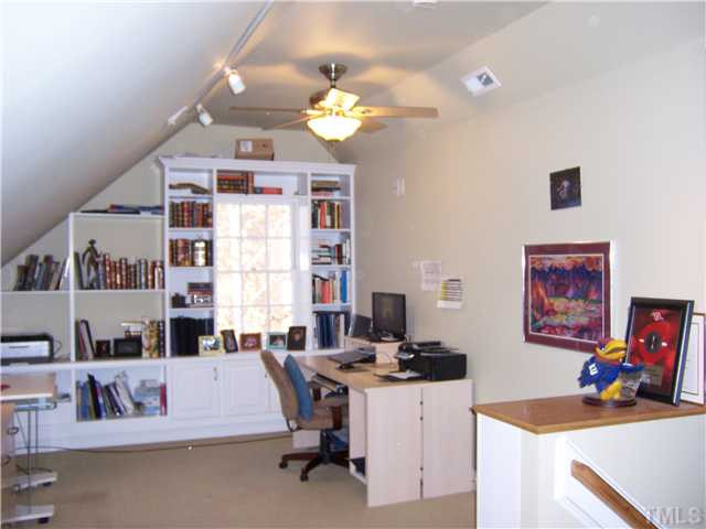 8005 Tanjier Bay Raleigh, NC 27613 - Photo 20 of 25 Listed as 5th bedroom possibility on the third floor. Closet and zoned HVAC with separate thermostat for temperature control. Also has a walkin attic storage at the opposite end of this room. Studio/Study/Office