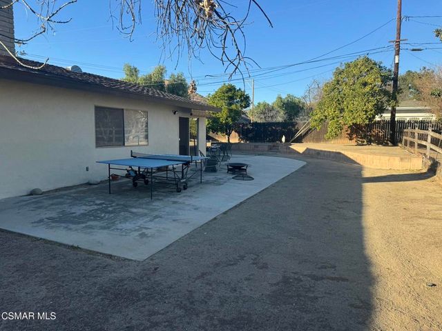 a view of a backyard with sitting area