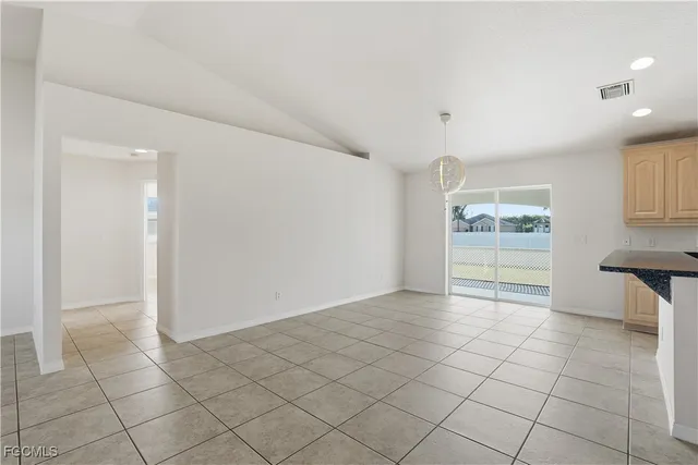 a bathroom with a sink double vanity granite tub and a mirror