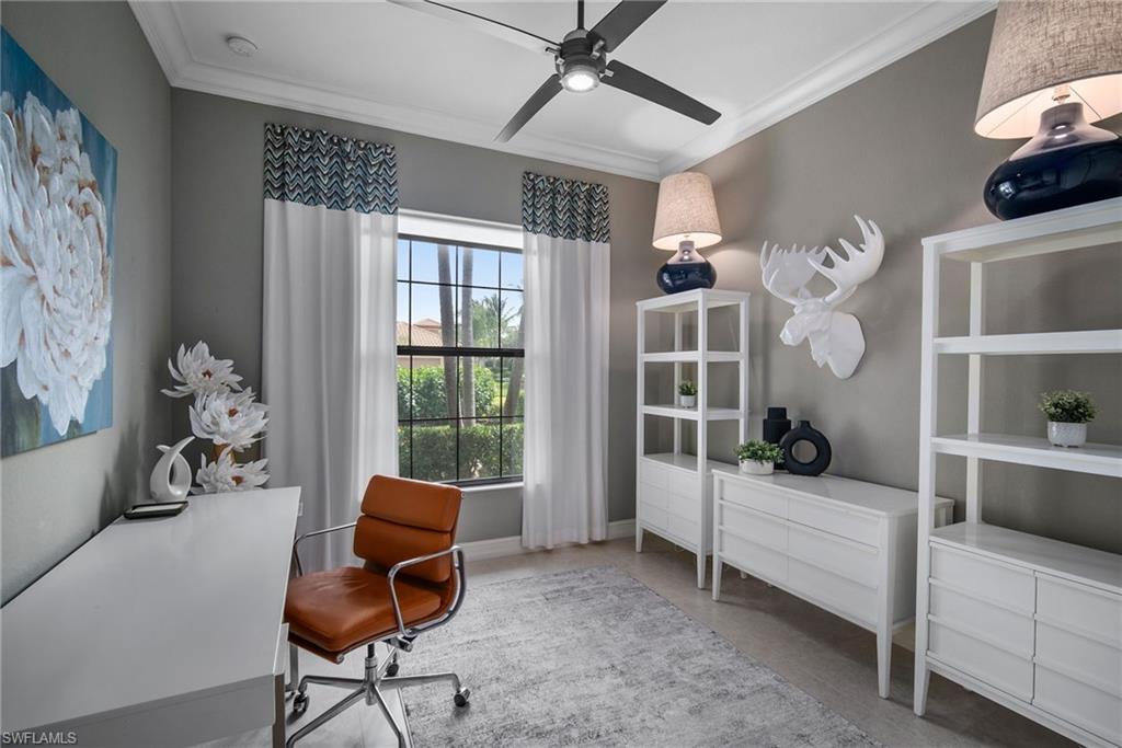 6565 Roma Way Naples, FL 34113 - Photo 15 of 32 a living room with furniture a rug and a window
