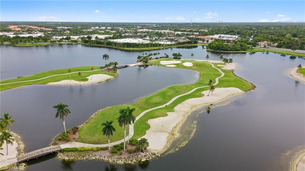 6565 Roma Way Naples, FL 34113 - Photo 26 of 32 an aerial view of a house with a swimming pool and outdoor seating