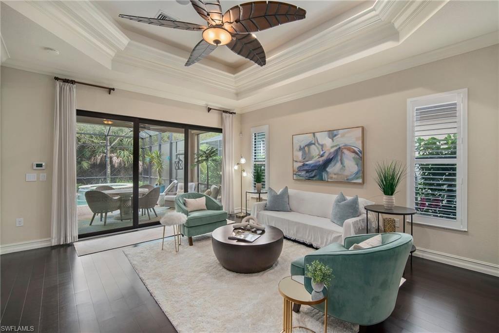 6565 Roma Way Naples, FL 34113 - Photo 4 of 32 a living room with furniture and a large window