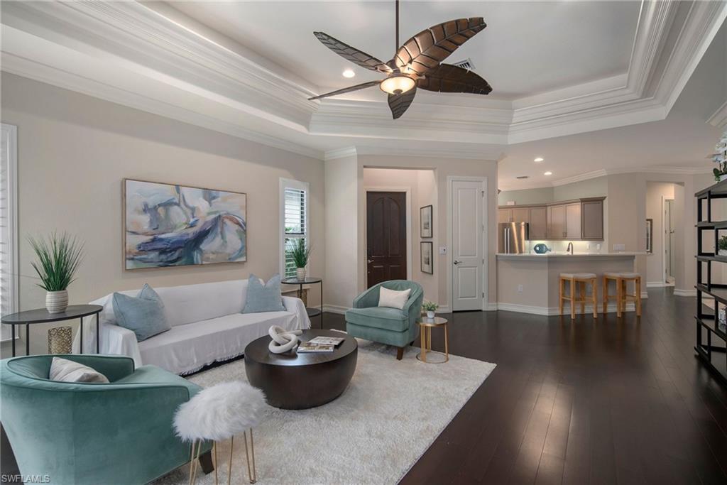 6565 Roma Way Naples, FL 34113 - Photo 7 of 32 a living room with furniture and a large window