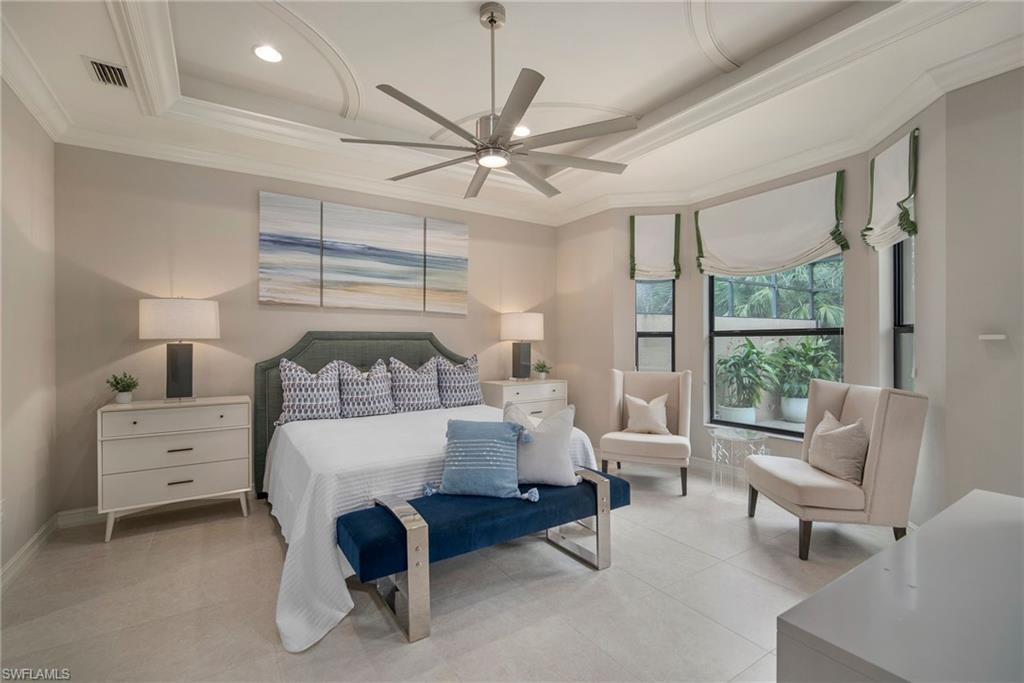 6565 Roma Way Naples, FL 34113 - Photo 10 of 32 a living room with furniture and a large window