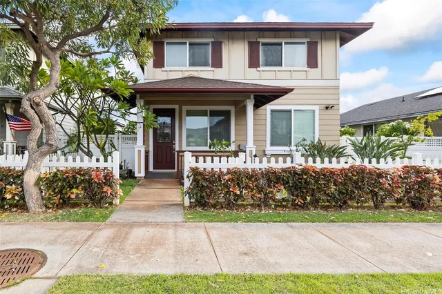 a view of a sitting area with golf table and chairs under an umbrella