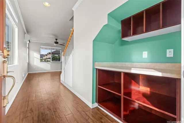 a view of an entryway with wooden floor