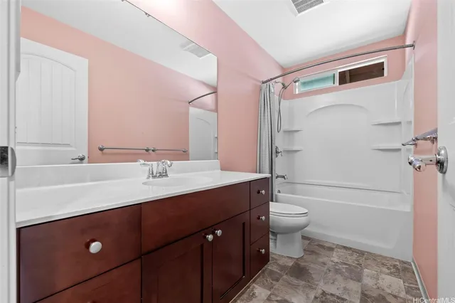 a bathroom with a double vanity sink toilet and shower
