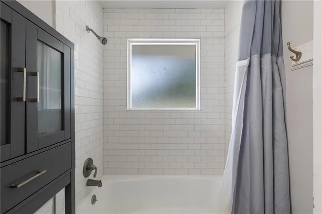 a bathroom with a bathtub