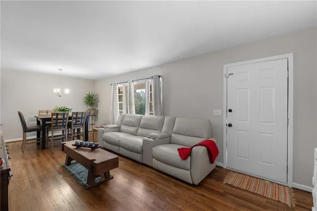 a living room with furniture rug and window