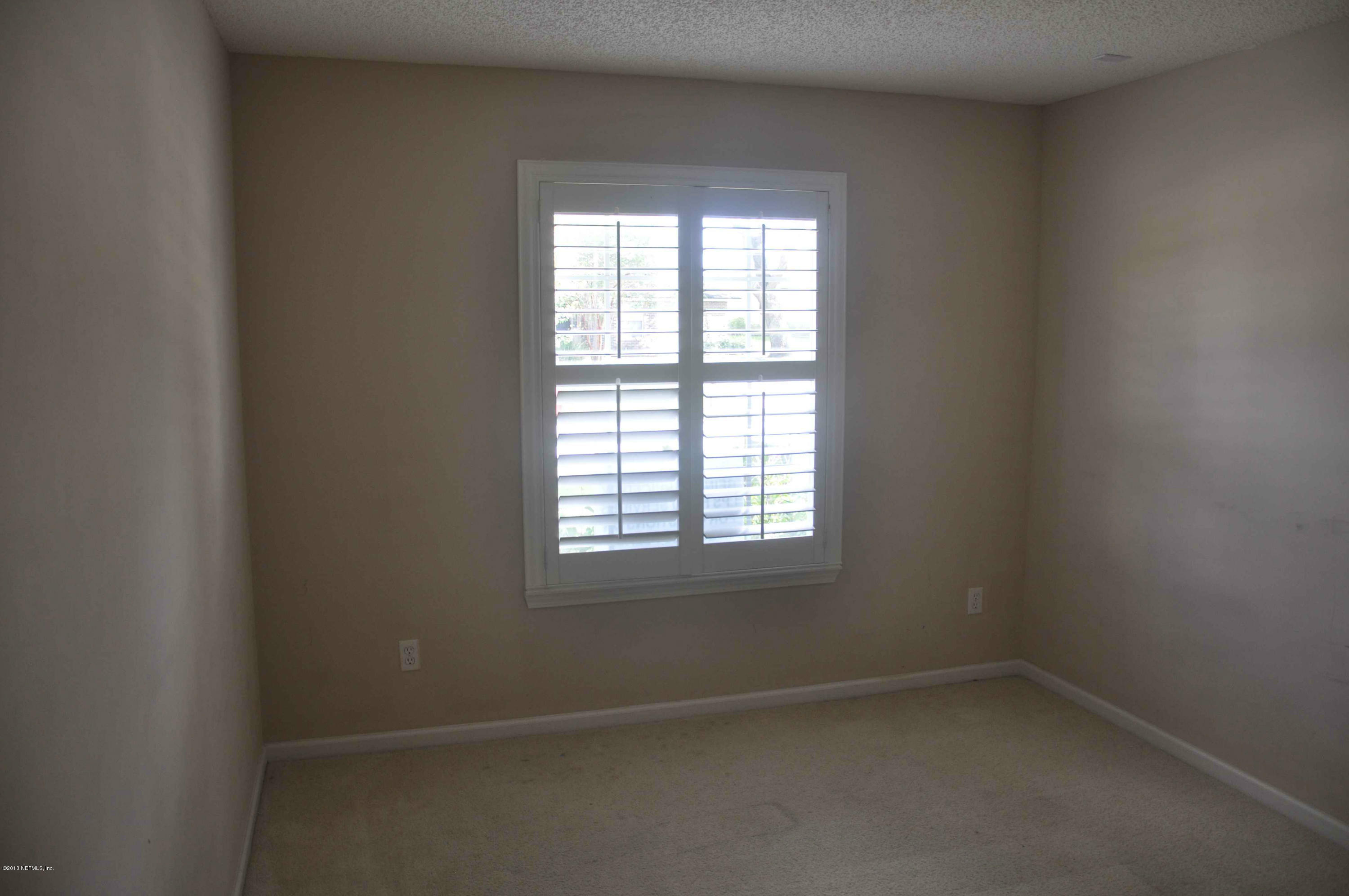 12010 Spring Ridge Drive Jacksonville, FL 32258 - Photo 4 of 18 an empty room with a window