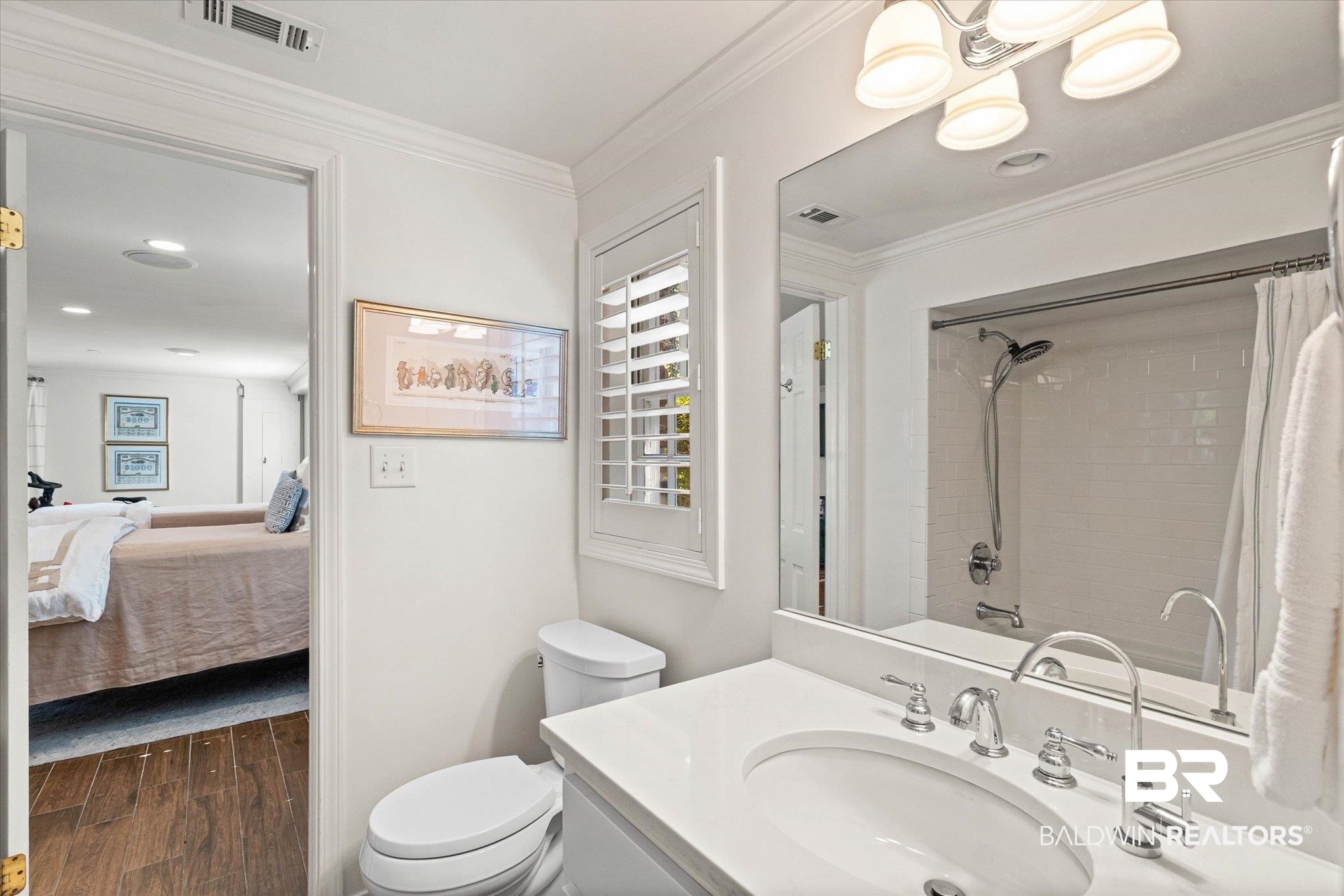3612 Linden Lane Mobile, AL 36608 - Photo 32 of 42 Full bath featuring crown molding, wood finished floors, a shower with shower curtain, vanity, and ensuite bath