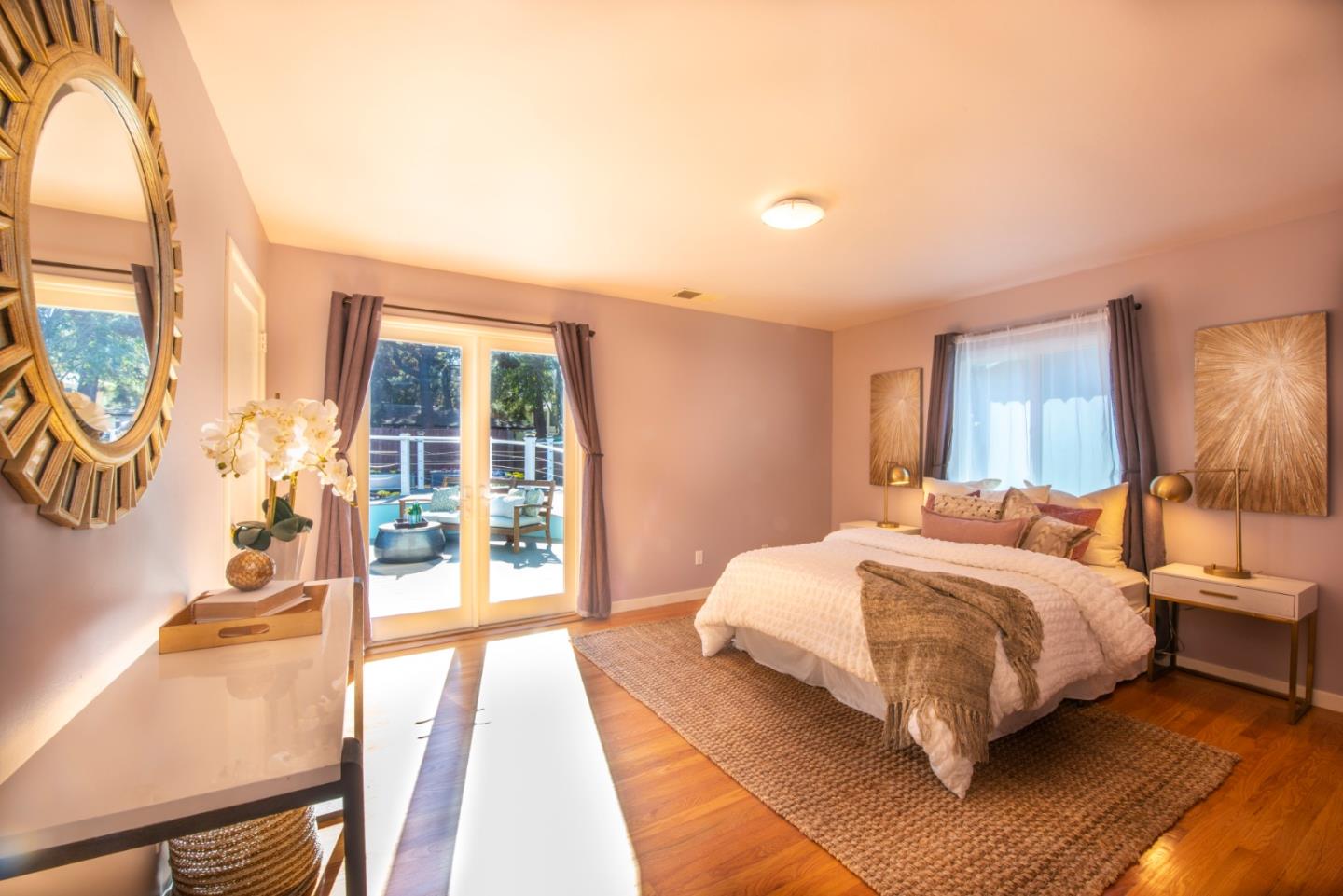 82 Loucks Avenue Los Altos, CA 94022 - Photo 11 of 23 a bedroom with a bed lamp and a large window with wooden floor