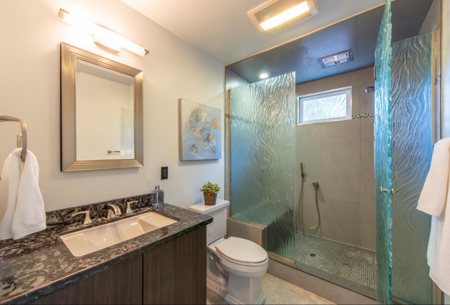 82 Loucks Avenue Los Altos, CA 94022 - Photo 15 of 23 a bathroom with a granite countertop sink toilet and shower