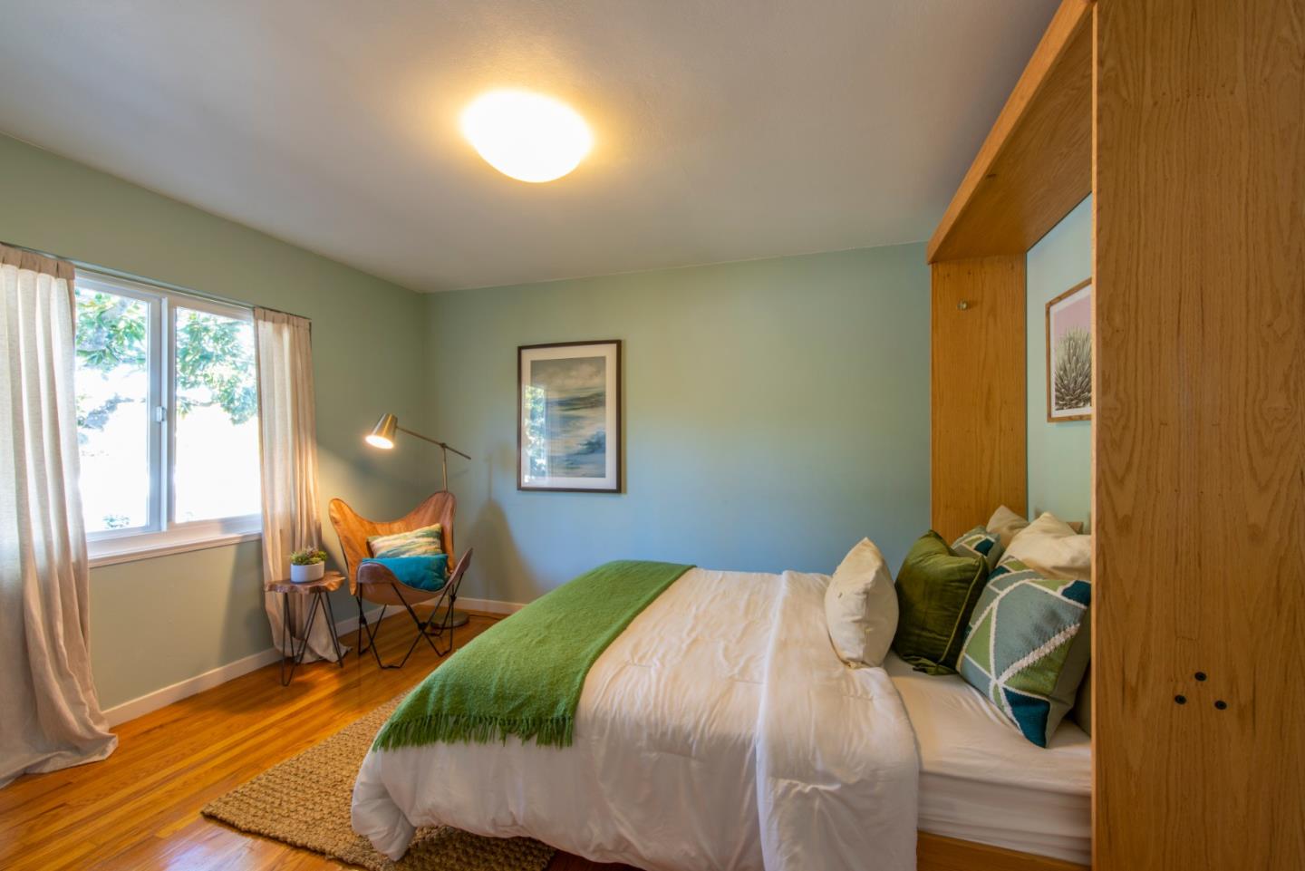 82 Loucks Avenue Los Altos, CA 94022 - Photo 17 of 23 a bedroom with a bed and wooden floor