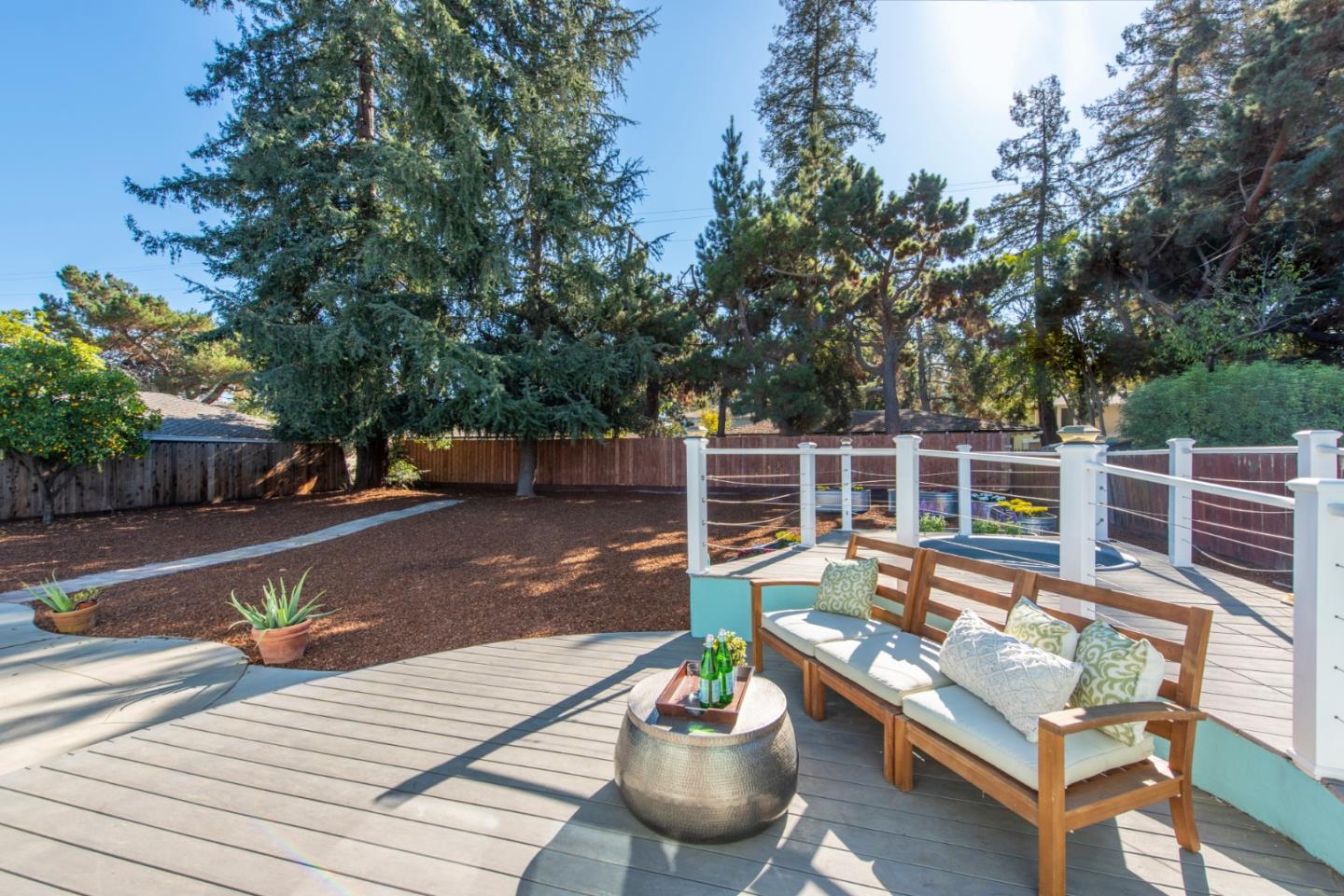 82 Loucks Avenue Los Altos, CA 94022 - Photo 23 of 23 a view of a patio with couches chairs and a fire pit