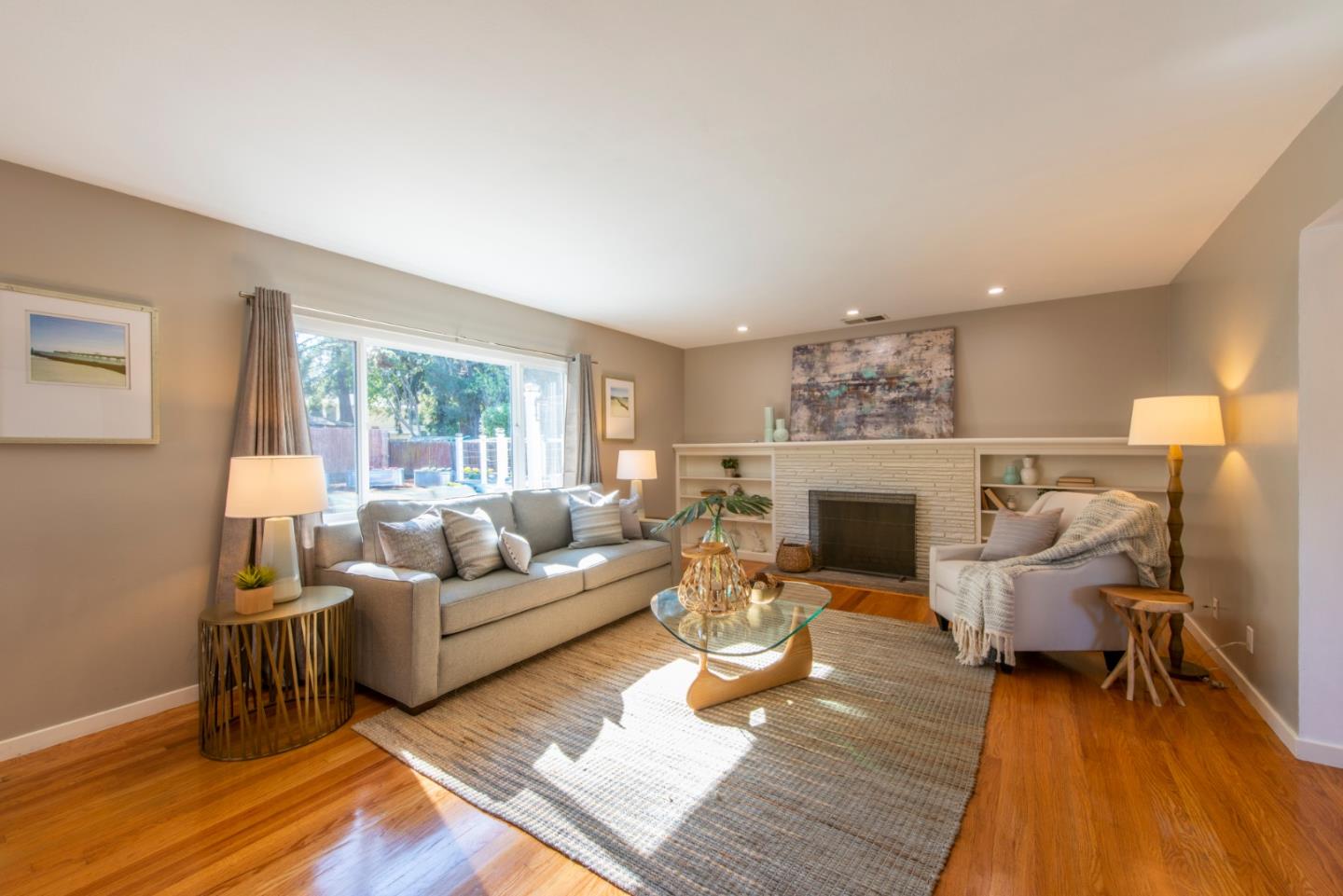 82 Loucks Avenue Los Altos, CA 94022 - Photo 4 of 23 a living room with furniture and a fireplace
