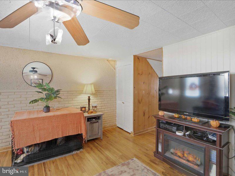 4344 Annapolis Road Halethorpe, MD 21227 - Photo 12 of 35 a living room with furniture and a flat screen tv