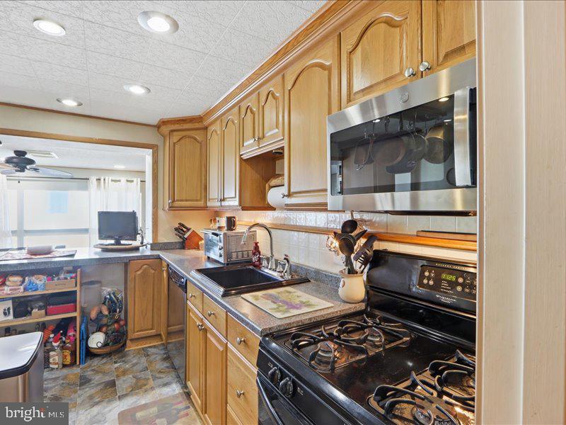 4344 Annapolis Road Halethorpe, MD 21227 - Photo 15 of 35 a kitchen with a stove and a sink