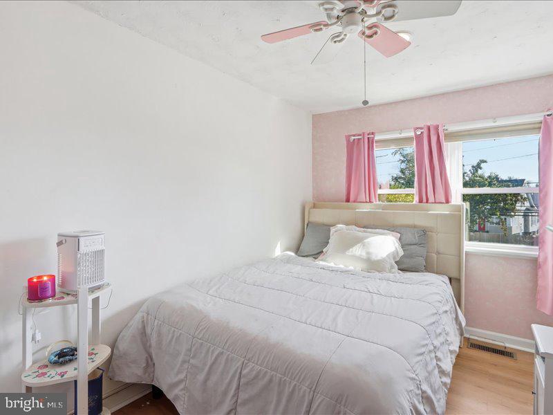 4344 Annapolis Road Halethorpe, MD 21227 - Photo 24 of 35 a bedroom with a bed and a chandelier