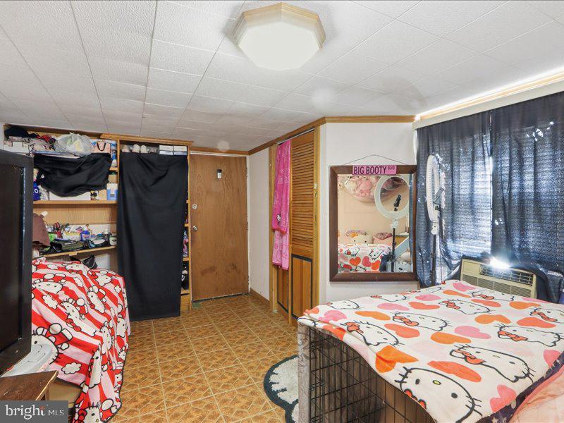 4344 Annapolis Road Halethorpe, MD 21227 - Photo 29 of 35 a bedroom with a bed and a mirror