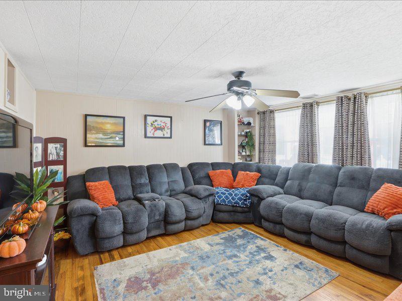 4344 Annapolis Road Halethorpe, MD 21227 - Photo 9 of 35 a living room with furniture and a couch