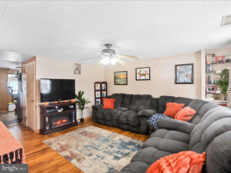 4344 Annapolis Road Halethorpe, MD 21227 - Photo 10 of 35 a living room with furniture and a flat screen tv